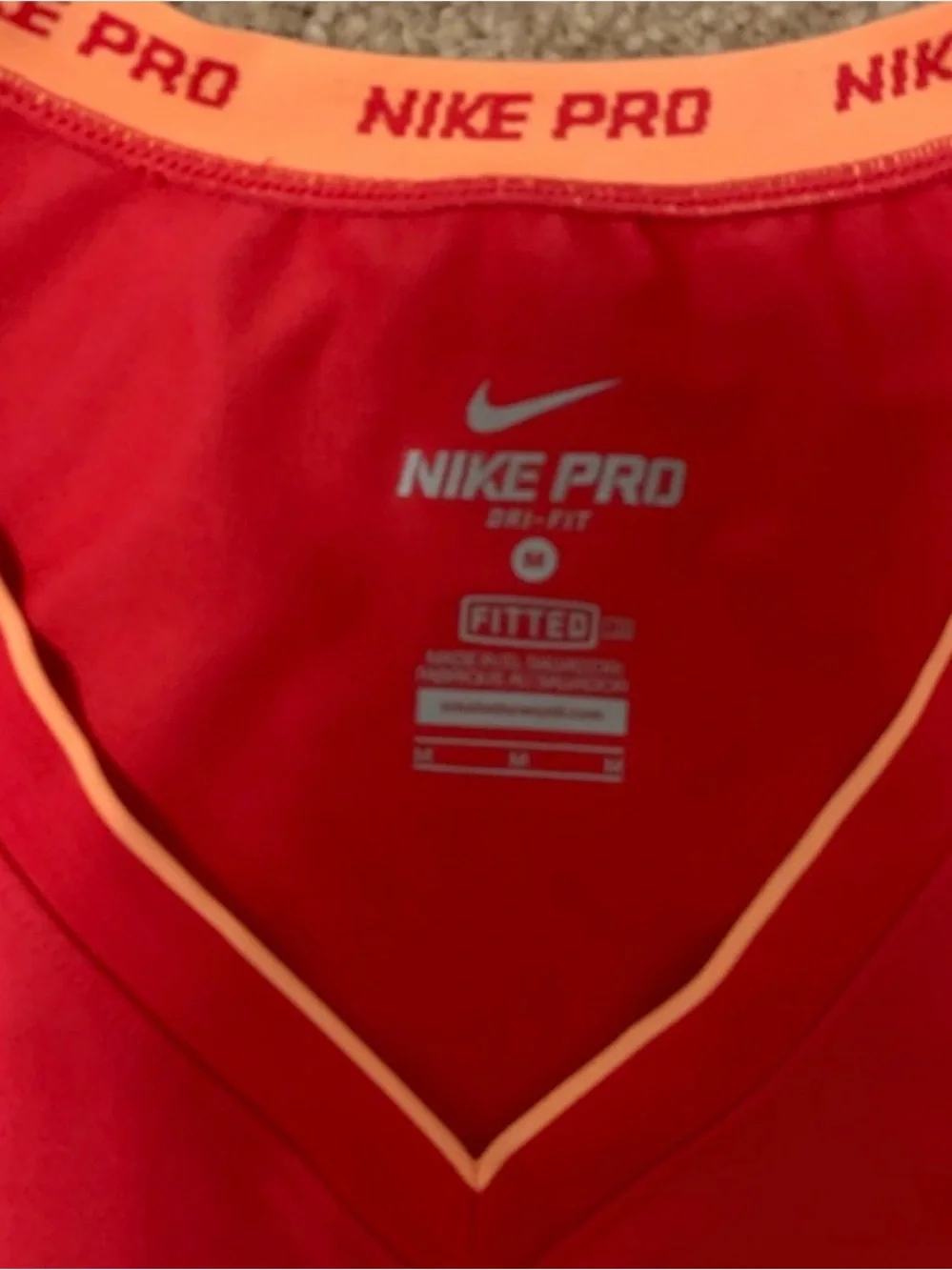 Nike Women's Red V-Neck Athletic Tank with Gold Swoosh